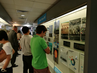 Guests of the “Climate Change 360ᵒ” opening reception view the displays.