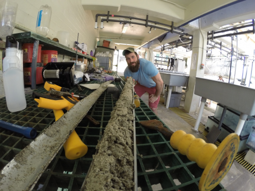 Cybulski looking down the “fossil time machine” containing coral fossils for analysis.
 (Photo credit: Dr Kiho Kim)
 